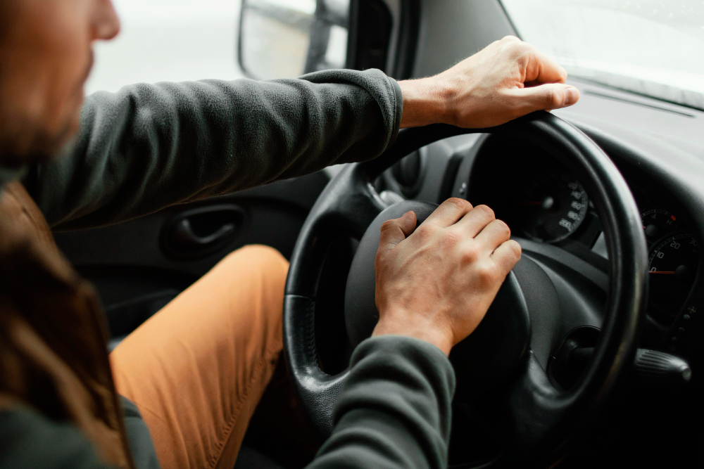 Driver smiling in EssquareRides car